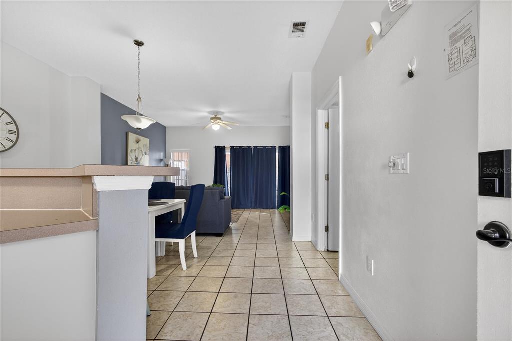 1066 Park Ridge Circle Kissimmee, FL 34746 - Photo 47 of 49 a view of kitchen with furniture and refrigerator