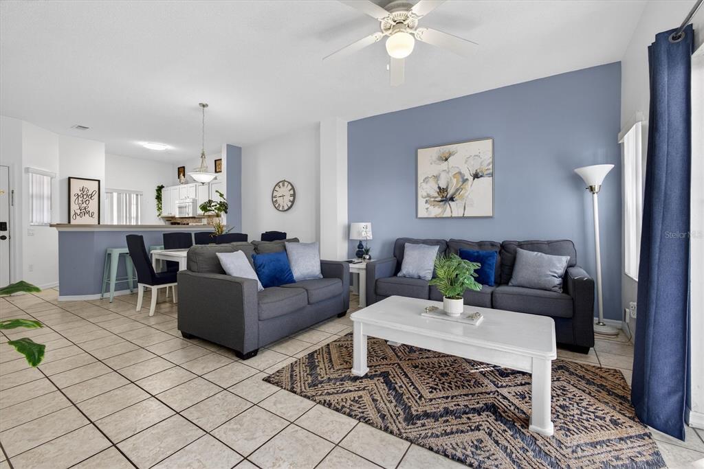 1066 Park Ridge Circle Kissimmee, FL 34746 - Photo 8 of 49 a living room with furniture and wooden floor