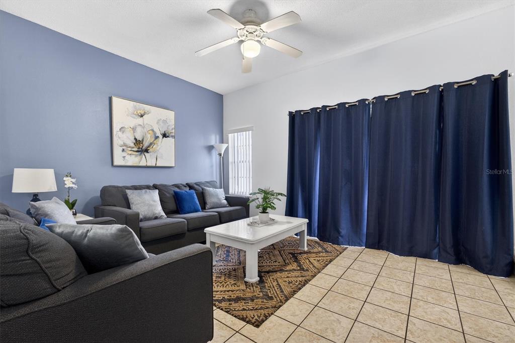 1066 Park Ridge Circle Kissimmee, FL 34746 - Photo 9 of 49 a living room with furniture and a table