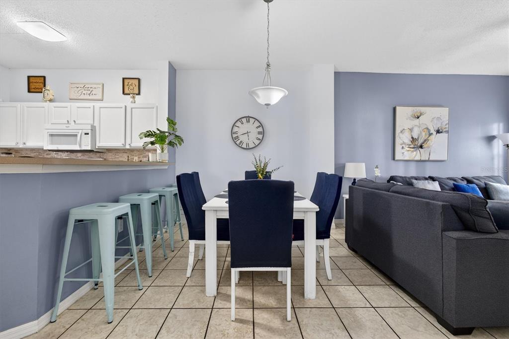 1066 Park Ridge Circle Kissimmee, FL 34746 - Photo 10 of 49 a view of a dining room with furniture