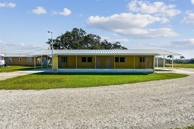 a view of an house with a garden