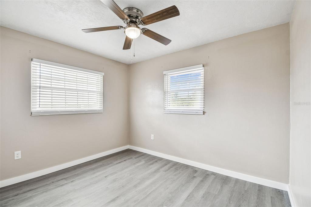 337 4th Street West, Unit A Palmetto, FL 34221 - Photo 14 of 25 an empty room with a window and a fan