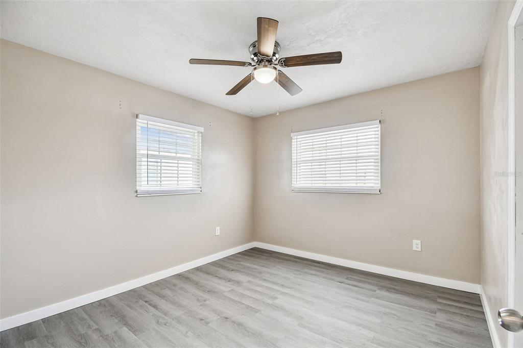 337 4th Street West, Unit A Palmetto, FL 34221 - Photo 16 of 25 an empty room with wooden floor window and ceiling fan