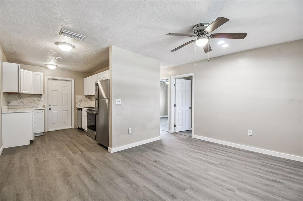 337 4th Street West, Unit A Palmetto, FL 34221 - Photo 23 of 25 a view of a kitchen with a sink and a refrigerator