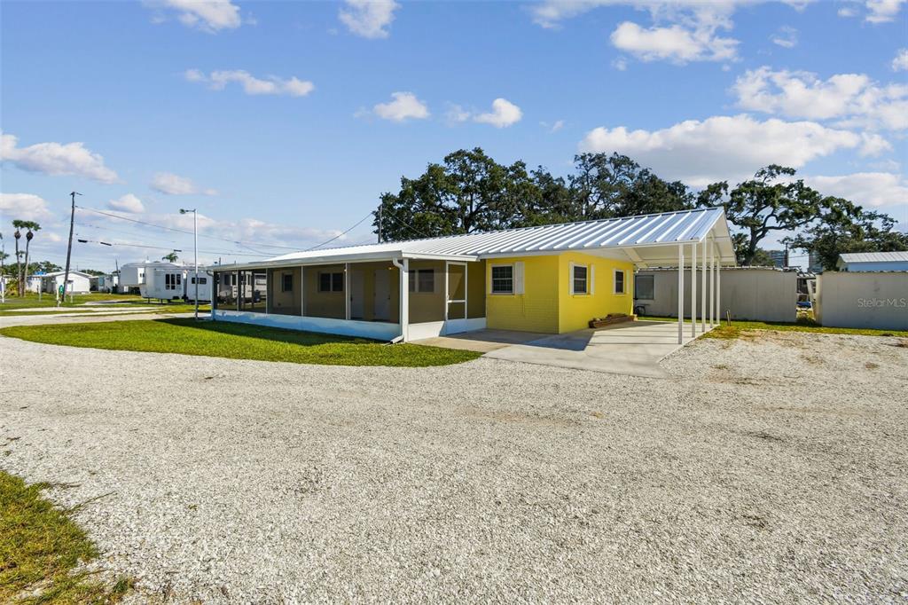 337 4th Street West, Unit A Palmetto, FL 34221 - Photo 24 of 25 a view of a house with swimming pool and a yard