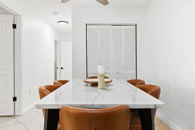 a dining room with table and chairs