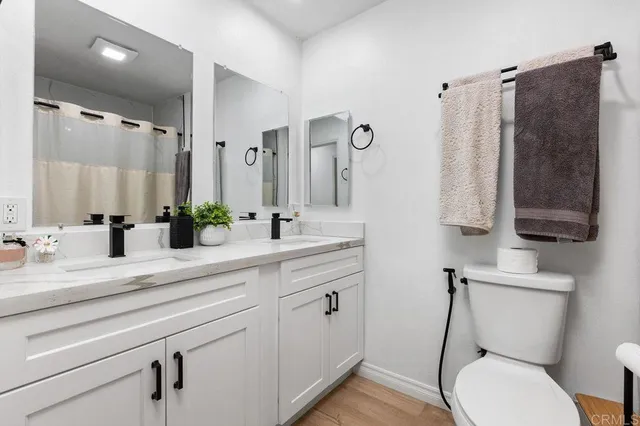 a bedroom with a large bed and a walk in closet