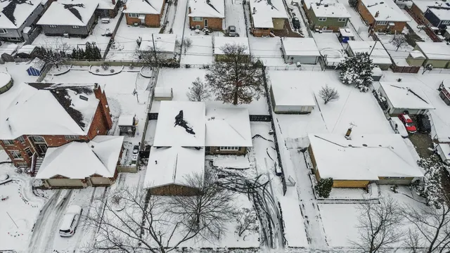 an aerial view of residential houses with outdoor space