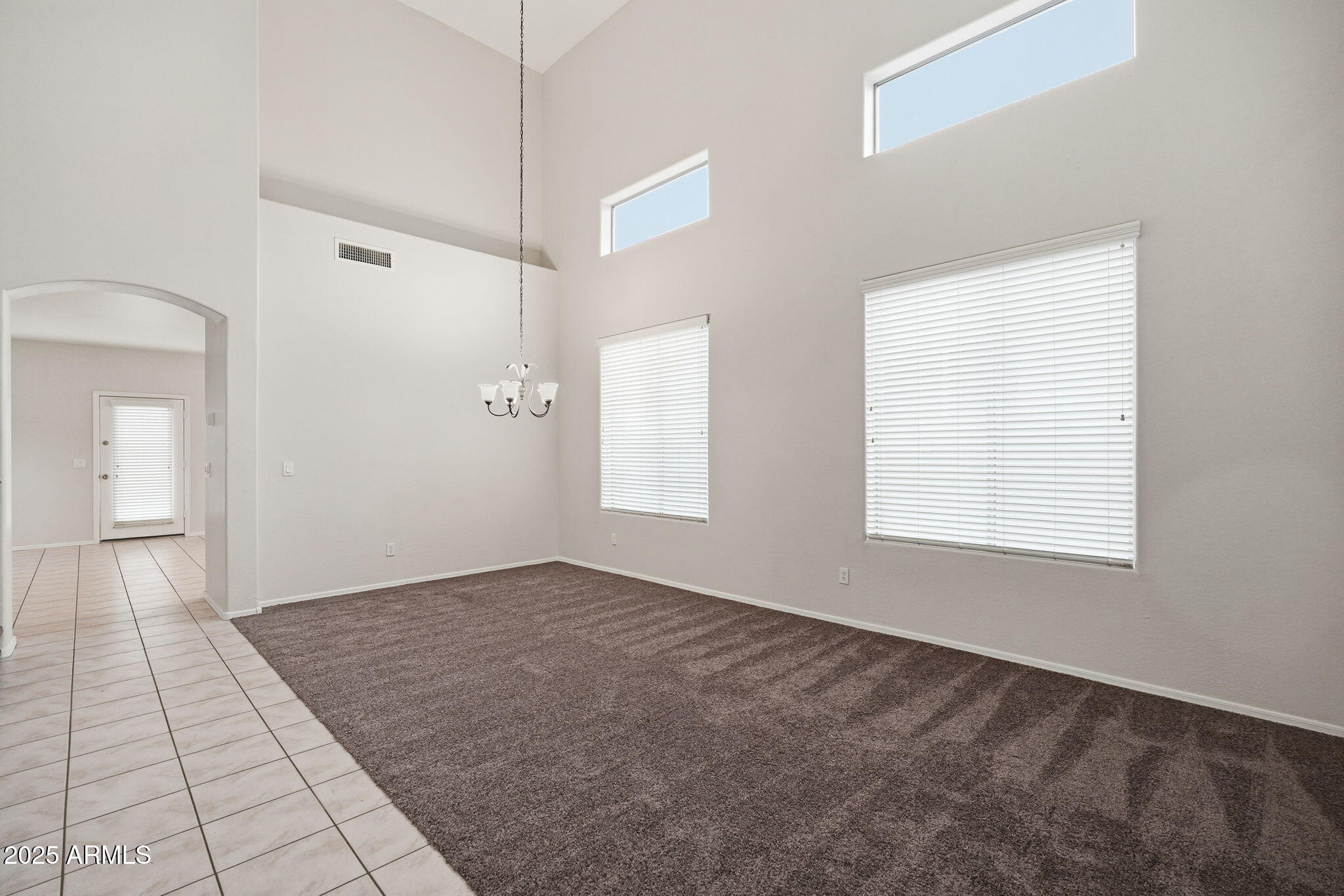 26913 North 85th Drive Peoria, AZ 85383 - Photo 8 of 48 a view of an empty room with window and a bathroom