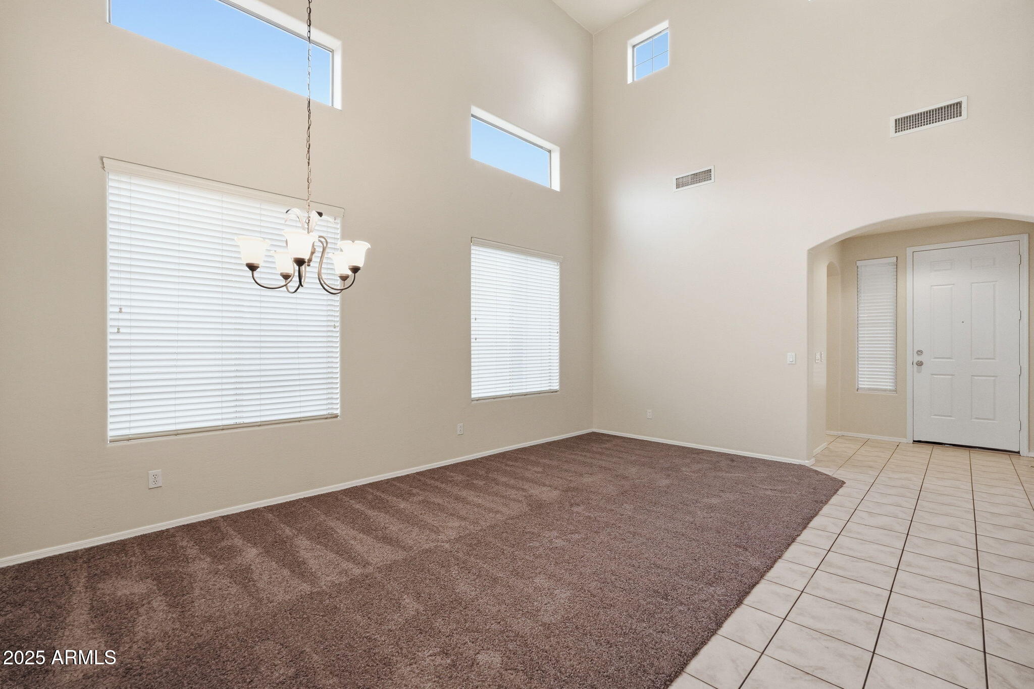 26913 North 85th Drive Peoria, AZ 85383 - Photo 9 of 48 a view of an empty room with a window