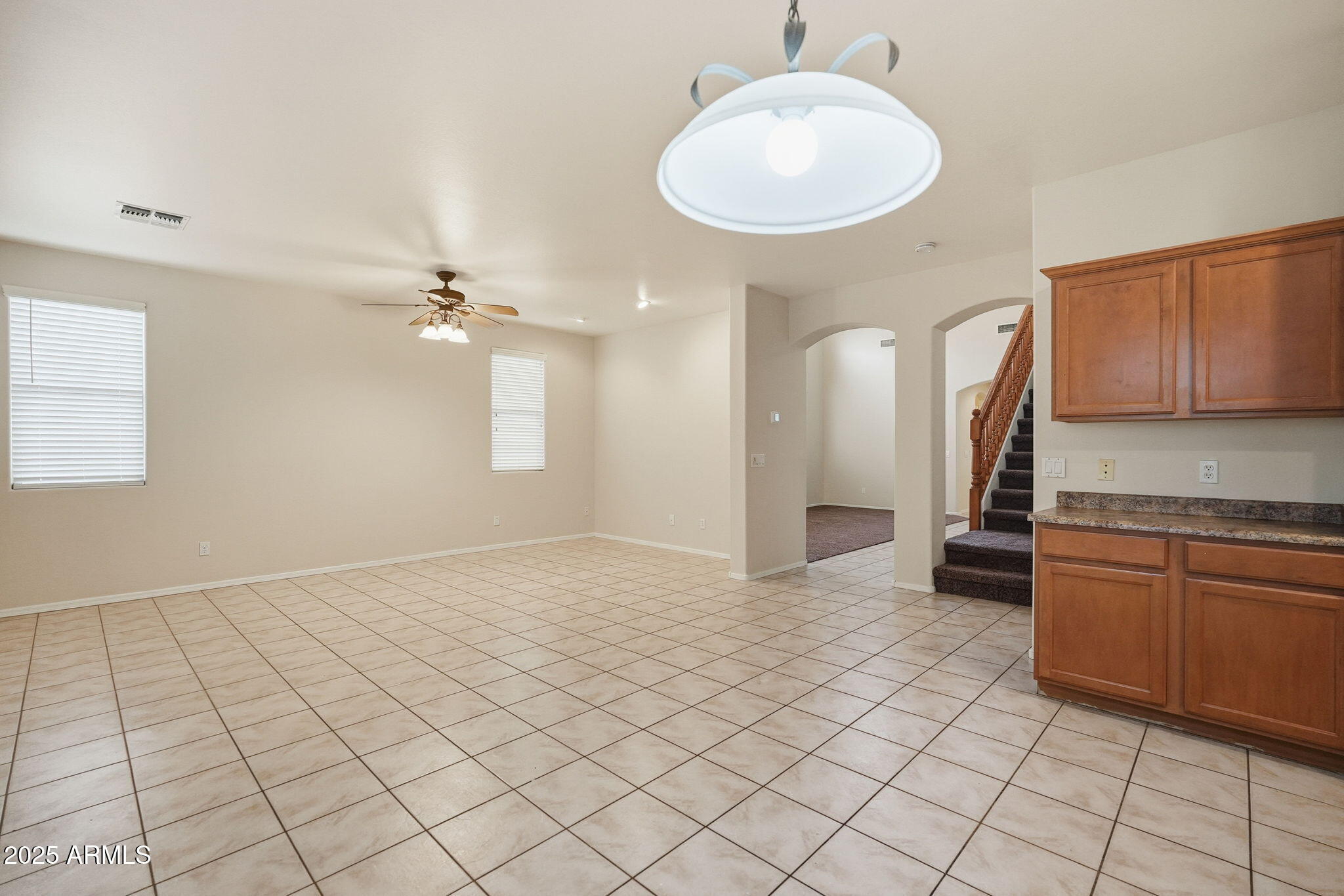 26913 North 85th Drive Peoria, AZ 85383 - Photo 10 of 48 a view of a kitchen with kitchen island granite countertop a sink cabinets and window