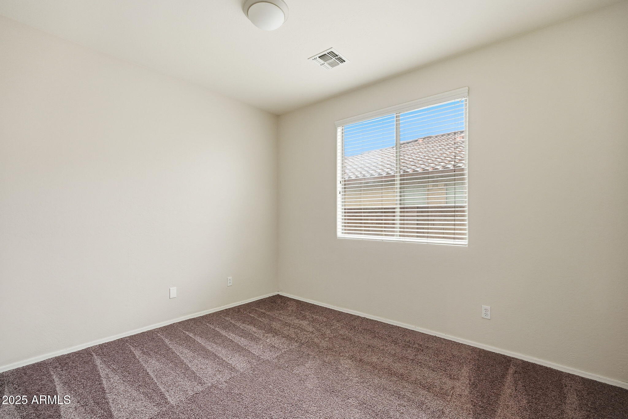 26913 North 85th Drive Peoria, AZ 85383 - Photo 19 of 48 an empty room with a window