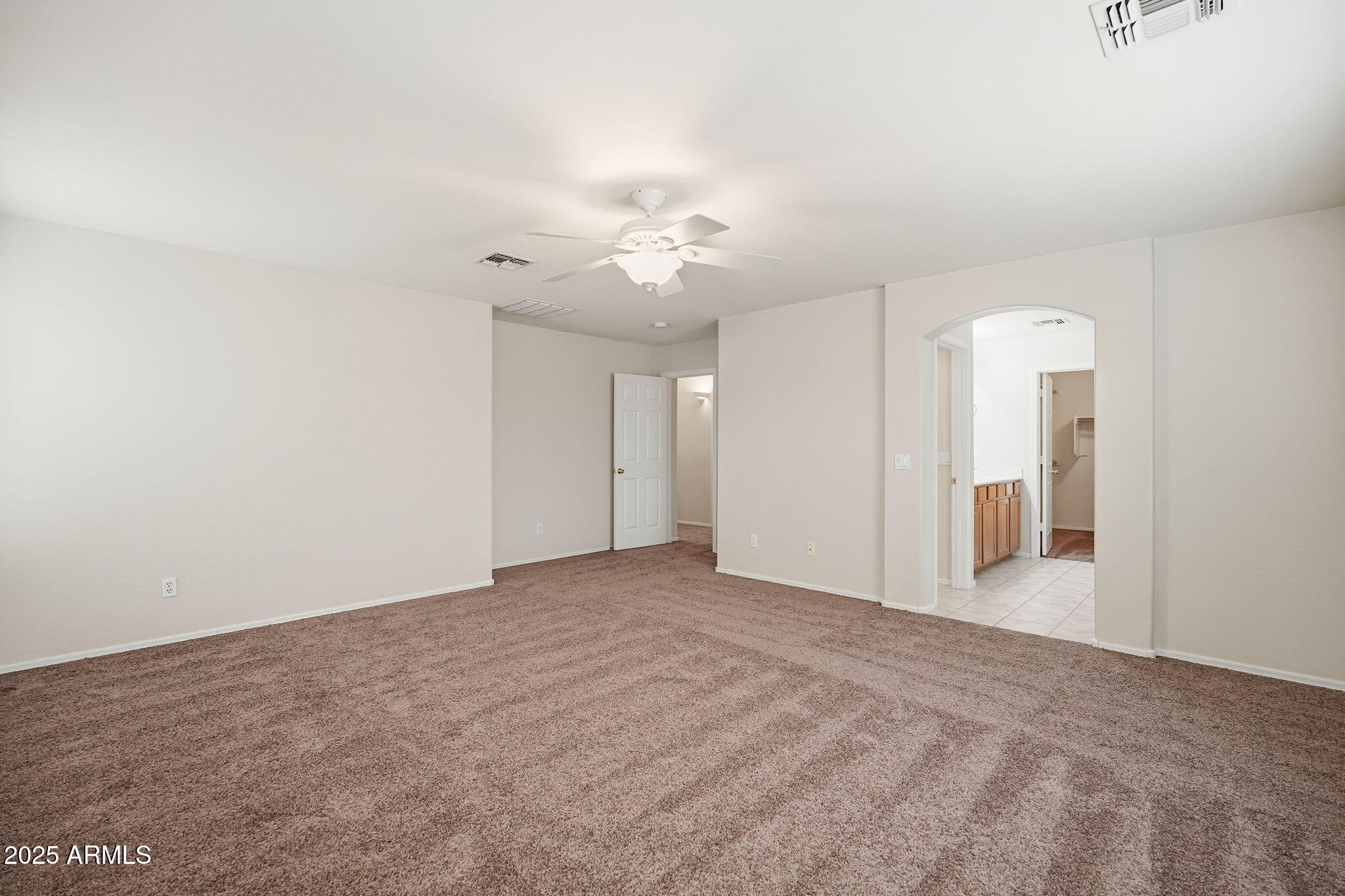 26913 North 85th Drive Peoria, AZ 85383 - Photo 27 of 48 a view of an empty room with a ceiling fan