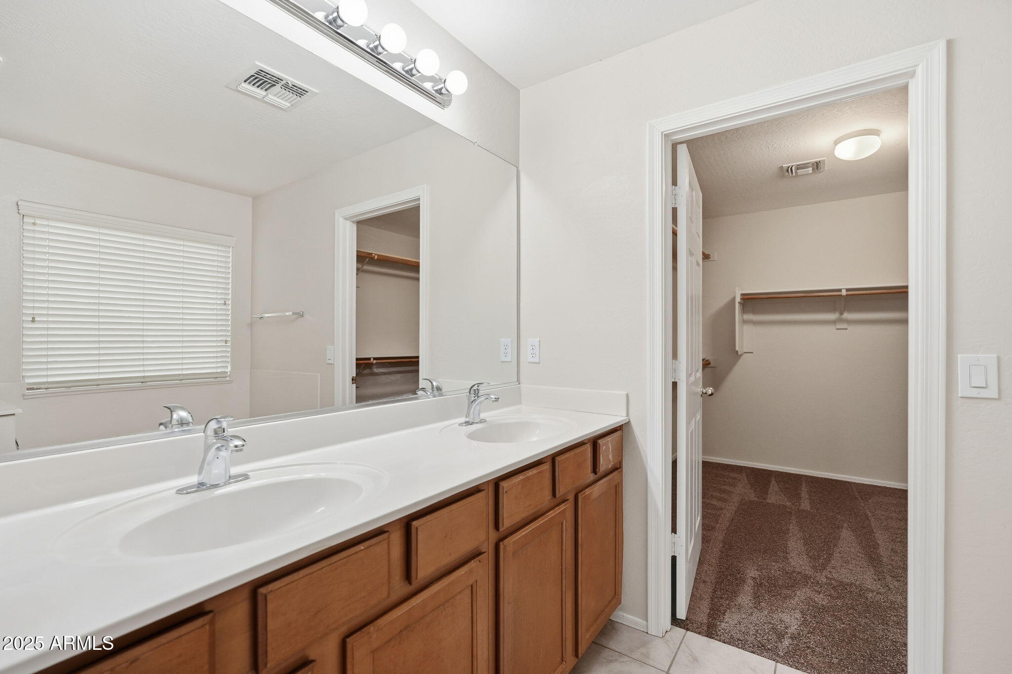 26913 North 85th Drive Peoria, AZ 85383 - Photo 36 of 48 a bathroom with a sink double vanity and a mirror