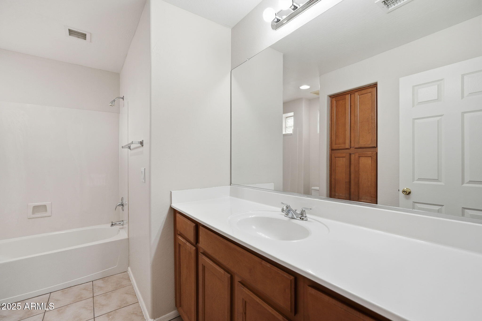 26913 North 85th Drive Peoria, AZ 85383 - Photo 38 of 48 a bathroom with a tub sink and mirror