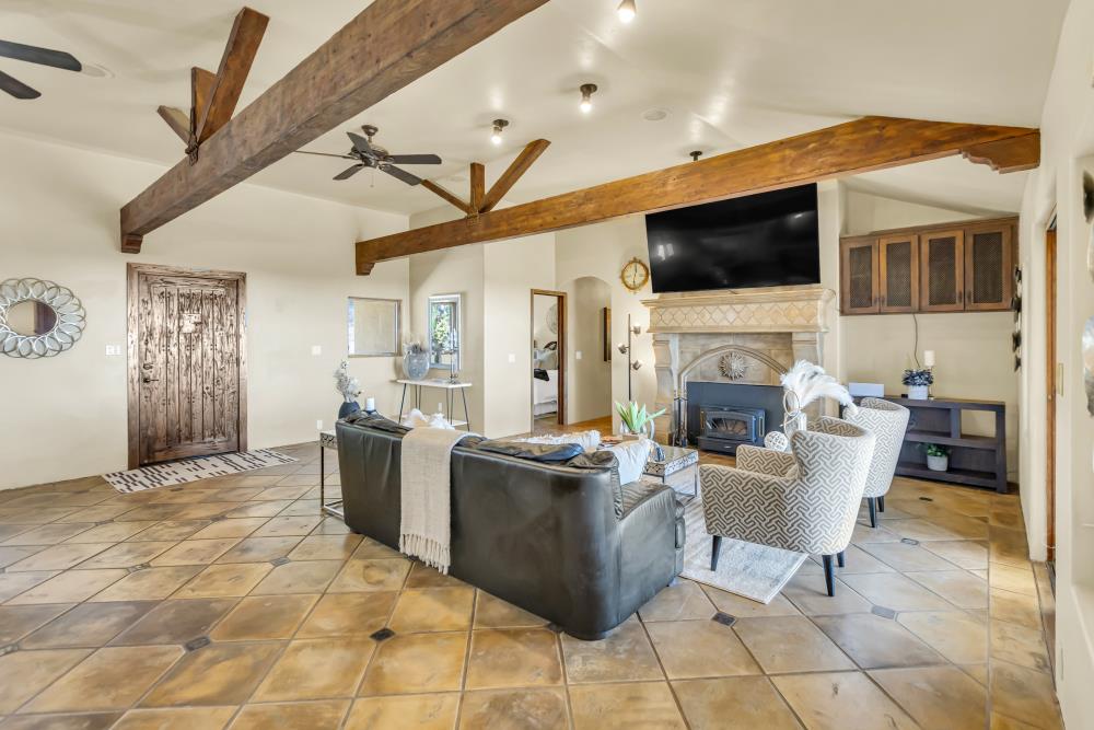 6780 McCourtney Road Lincoln, CA 95648 - Photo 1 of 37 a living room with furniture a flat screen tv and a fireplace