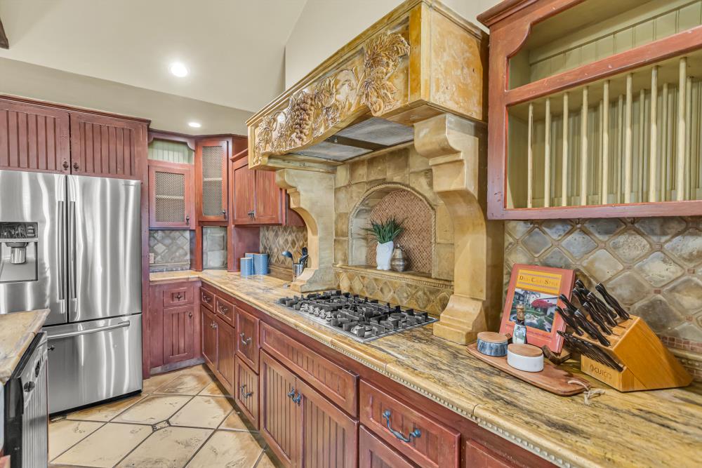 6780 McCourtney Road Lincoln, CA 95648 - Photo 14 of 37 a kitchen with stainless steel appliances granite countertop a stove and a refrigerator