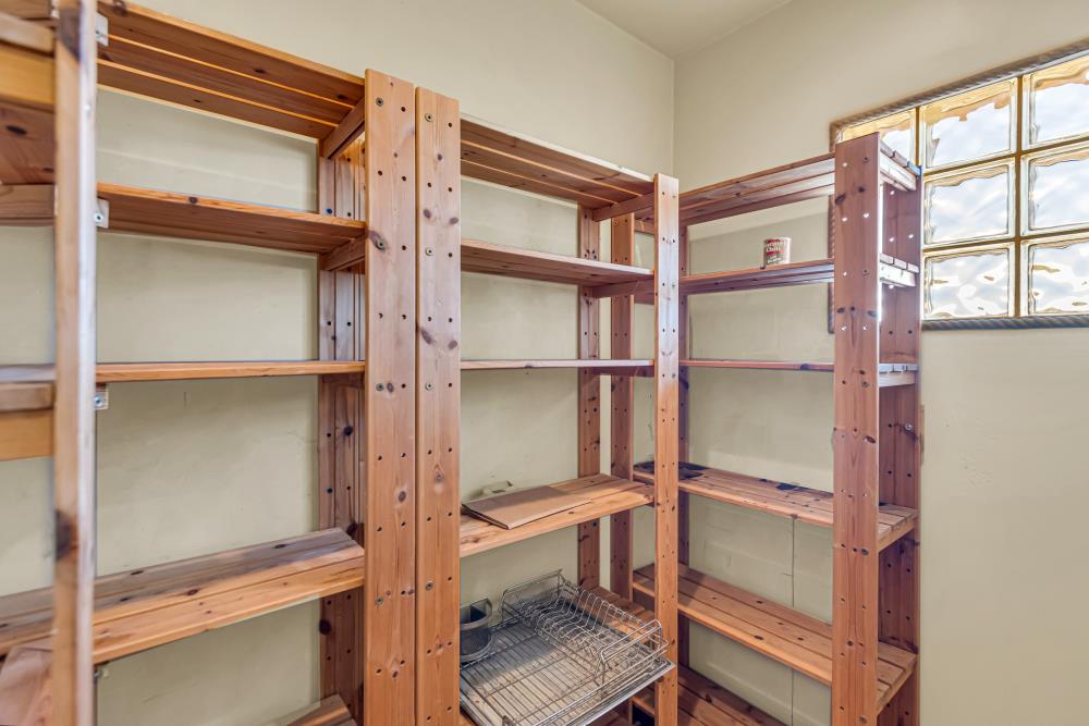 6780 McCourtney Road Lincoln, CA 95648 - Photo 18 of 37 a room with rack on the wall and a window