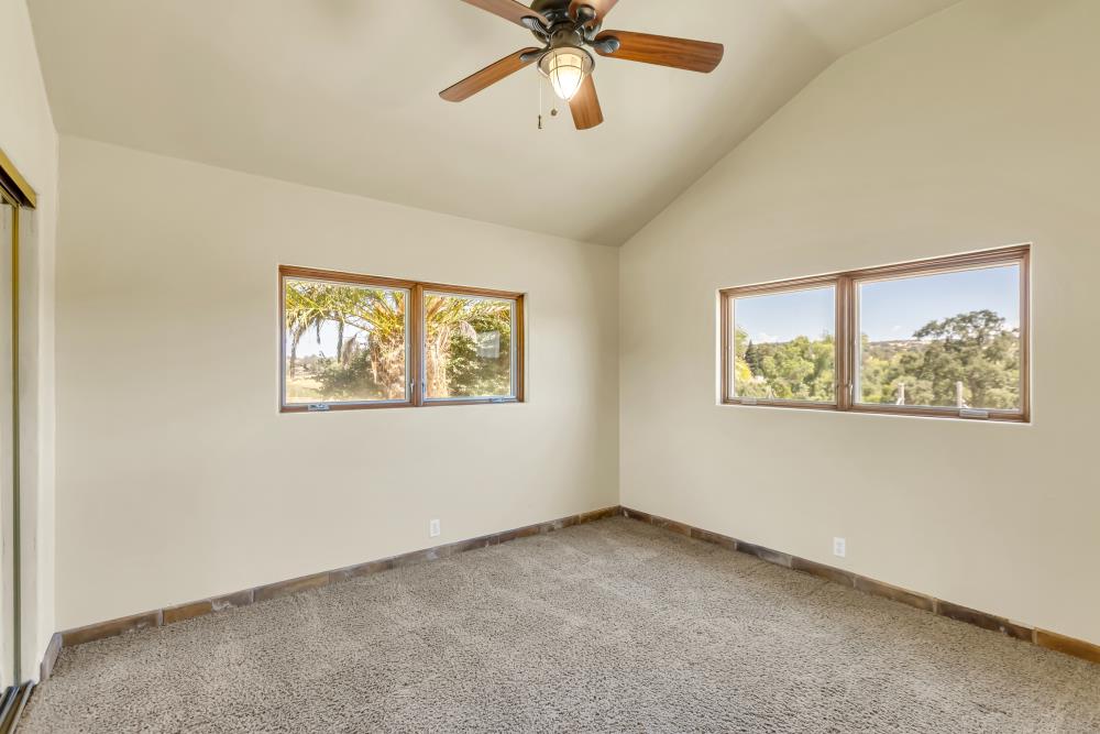 6780 McCourtney Road Lincoln, CA 95648 - Photo 24 of 37 an empty room with windows and fan