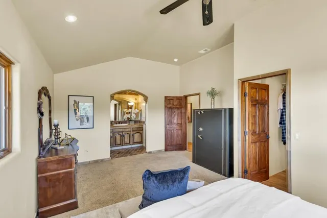a bedroom with furniture and window
