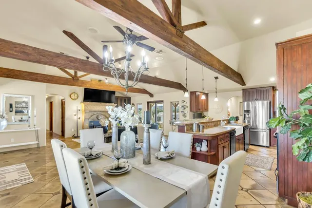 a living room with stainless steel appliances kitchen island granite countertop furniture and a kitchen view