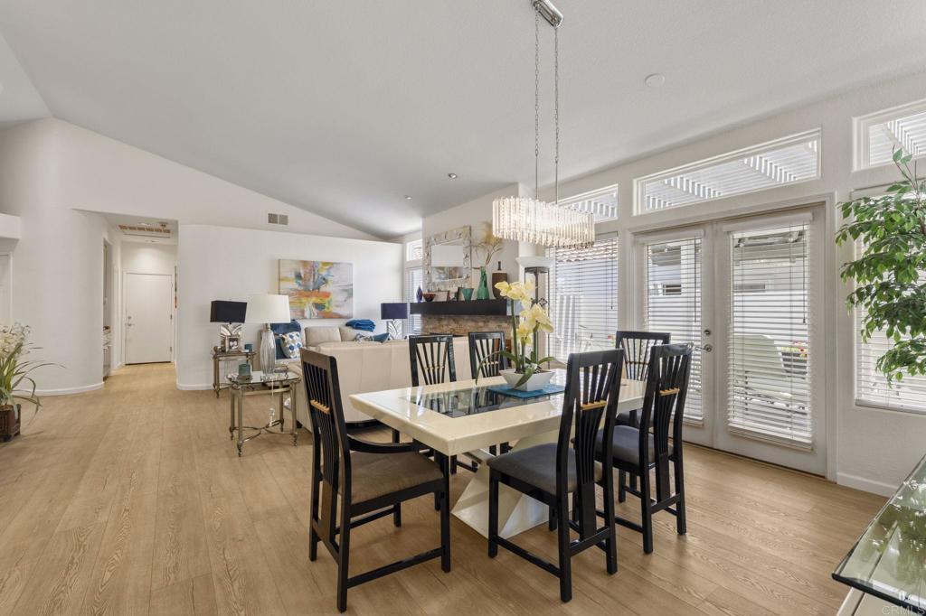 4939 Tilos Way Oceanside, CA 92056 - Photo 15 of 49 a view of a dining room with furniture and wooden floor