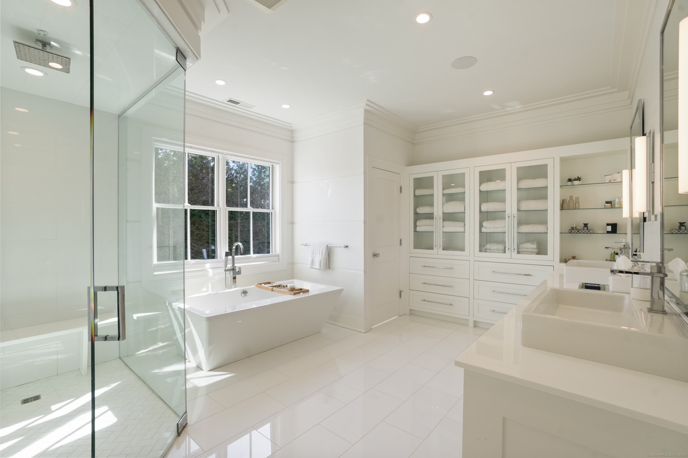 9 Burr Farms Road Westport, CT 06880 - Photo 15 of 40 a bathroom with a tub sink shower and mirror