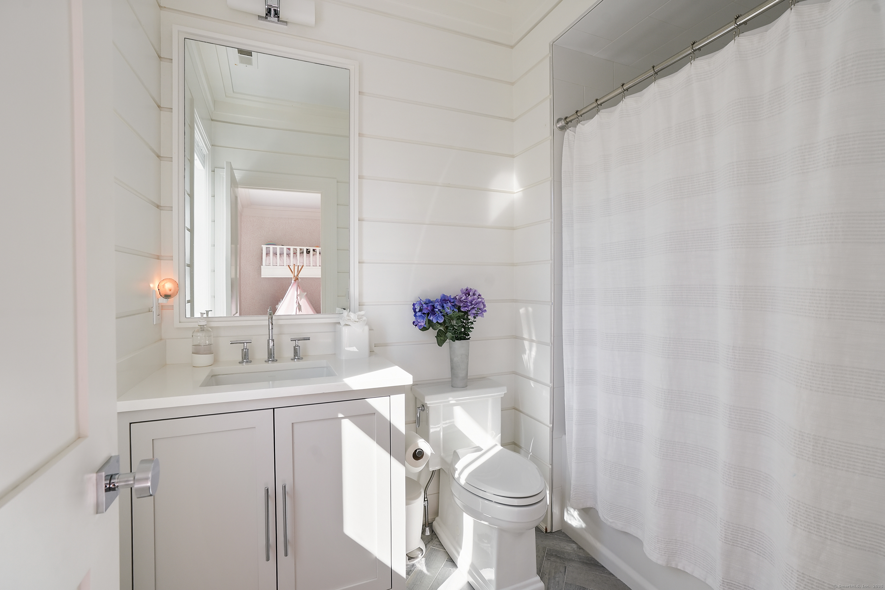 9 Burr Farms Road Westport, CT 06880 - Photo 21 of 40 a bathroom with a sink a toilet and tub