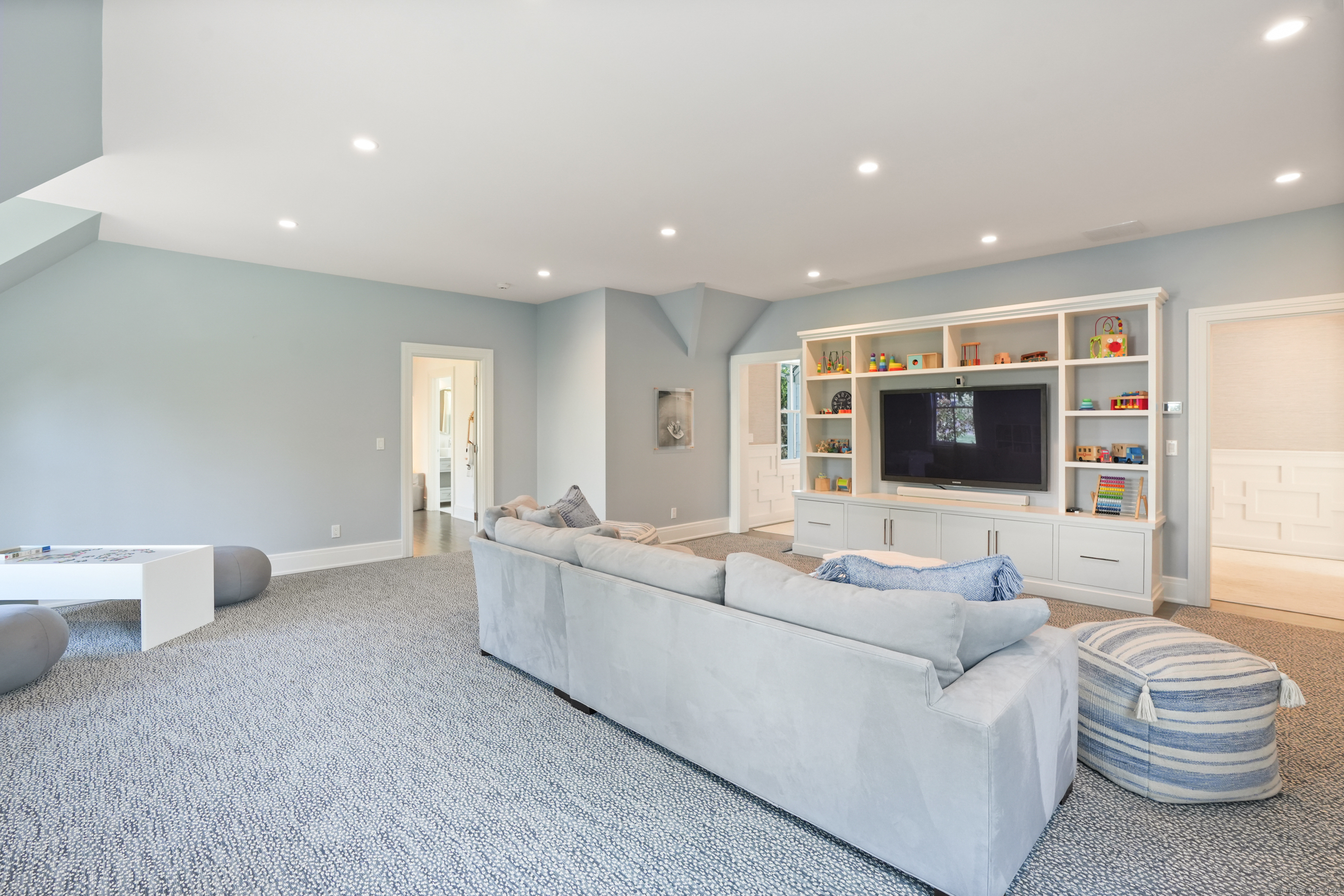 9 Burr Farms Road Westport, CT 06880 - Photo 23 of 40 a living room with furniture and a flat screen tv