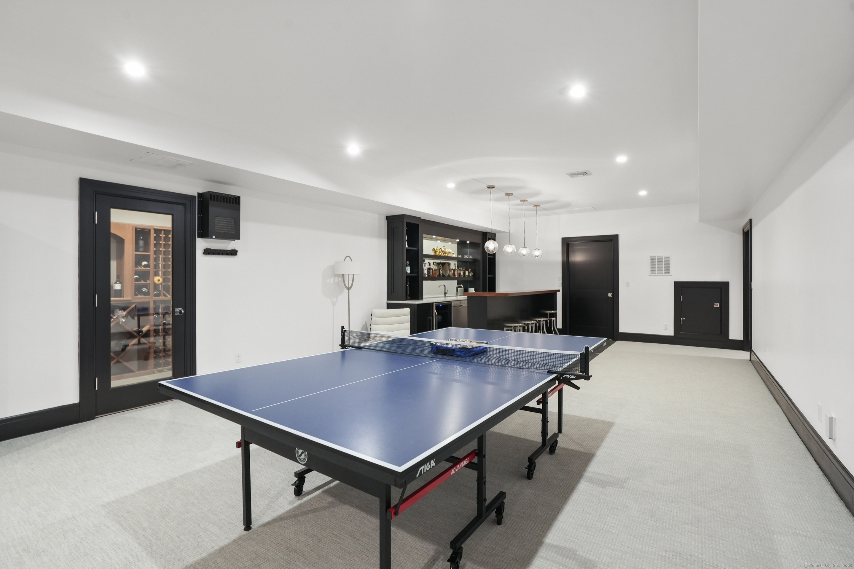 9 Burr Farms Road Westport, CT 06880 - Photo 27 of 40 a view of a kitchen with a table and chairs