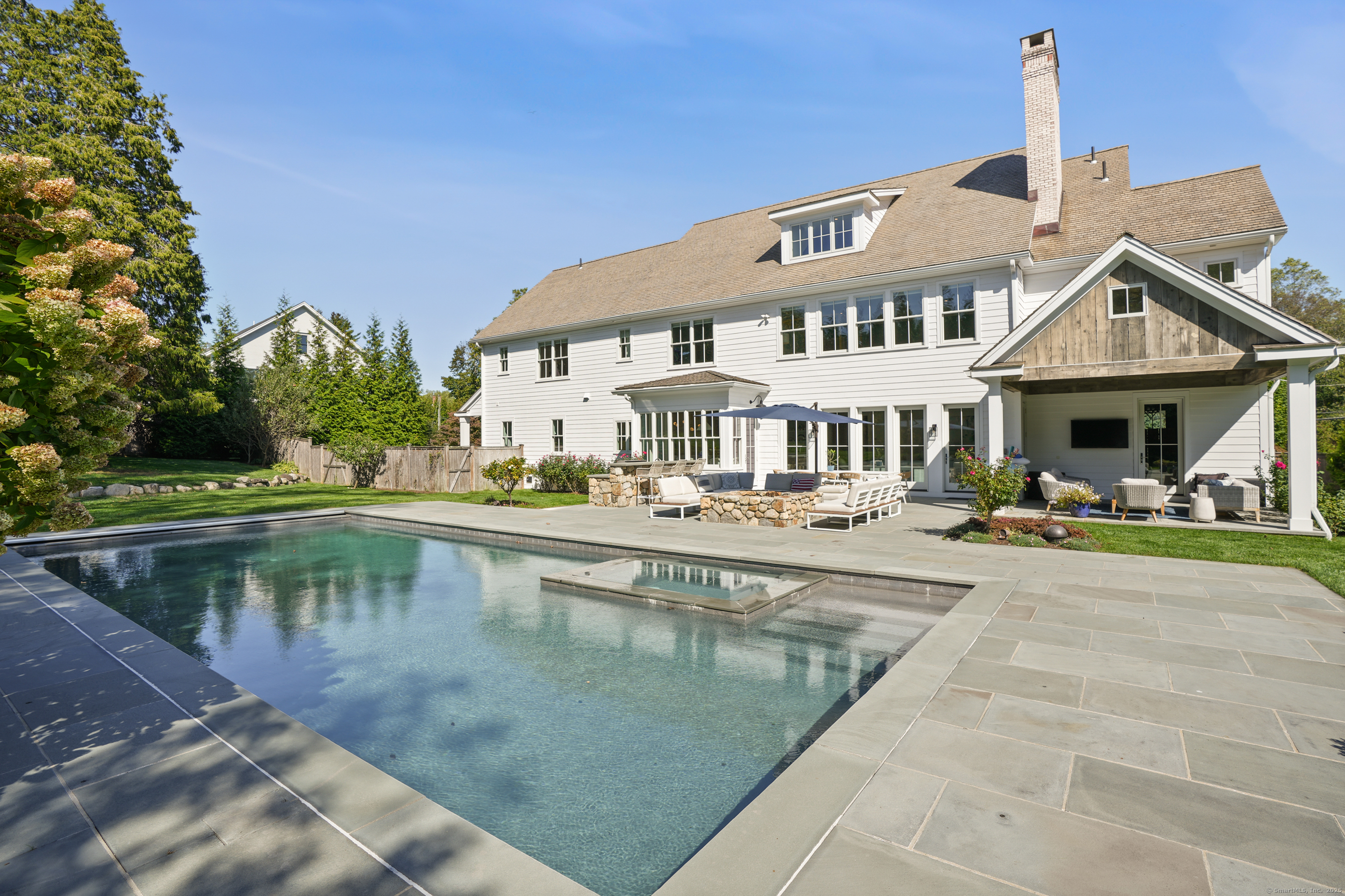 9 Burr Farms Road Westport, CT 06880 - Photo 31 of 40 a view of a house with swimming pool