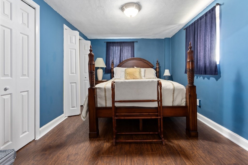 68 Bryon Road, Unit 2 Boston, MA 02467 - Photo 13 of 18 a bedroom with a bed and a dresser