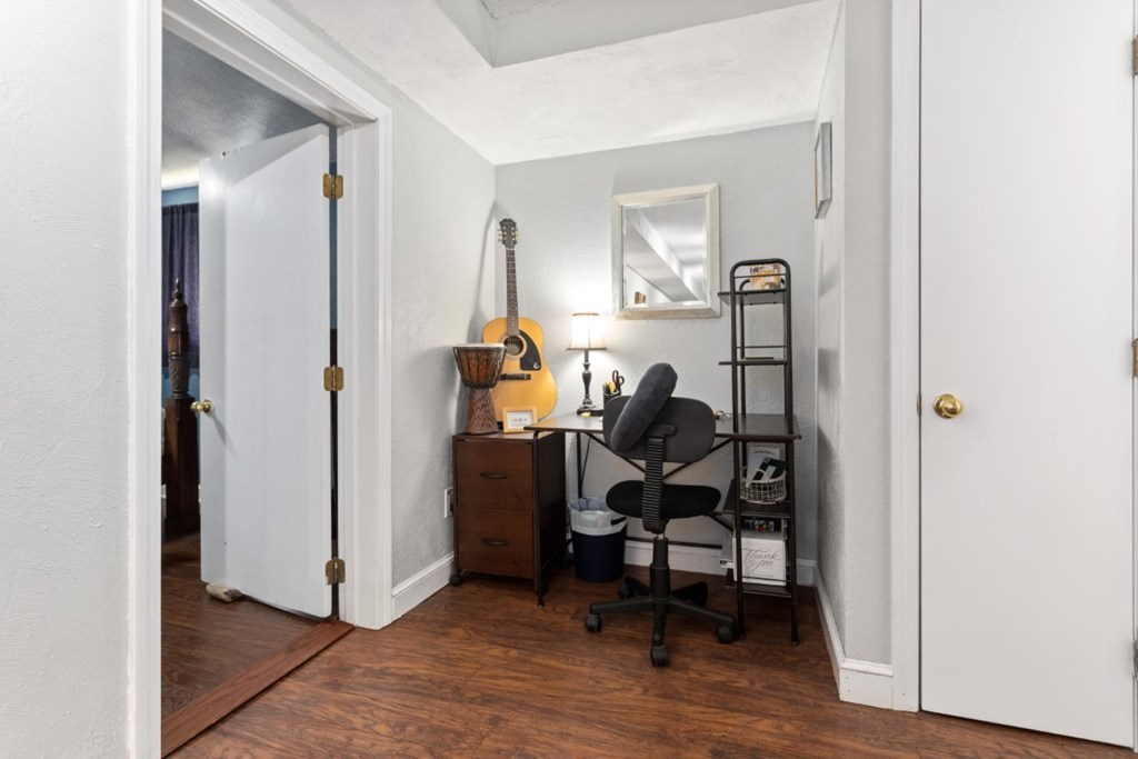 68 Bryon Road, Unit 2 Boston, MA 02467 - Photo 10 of 18 a view of a workspace with furniture and a window