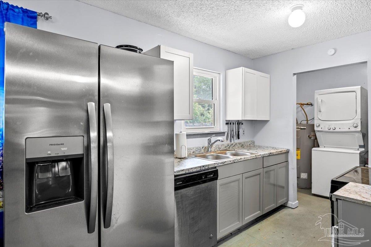 3060 Safronia Shores Road Navarre, FL 32566 - Photo 14 of 28 a kitchen with a sink stainless steel appliances and cabinets