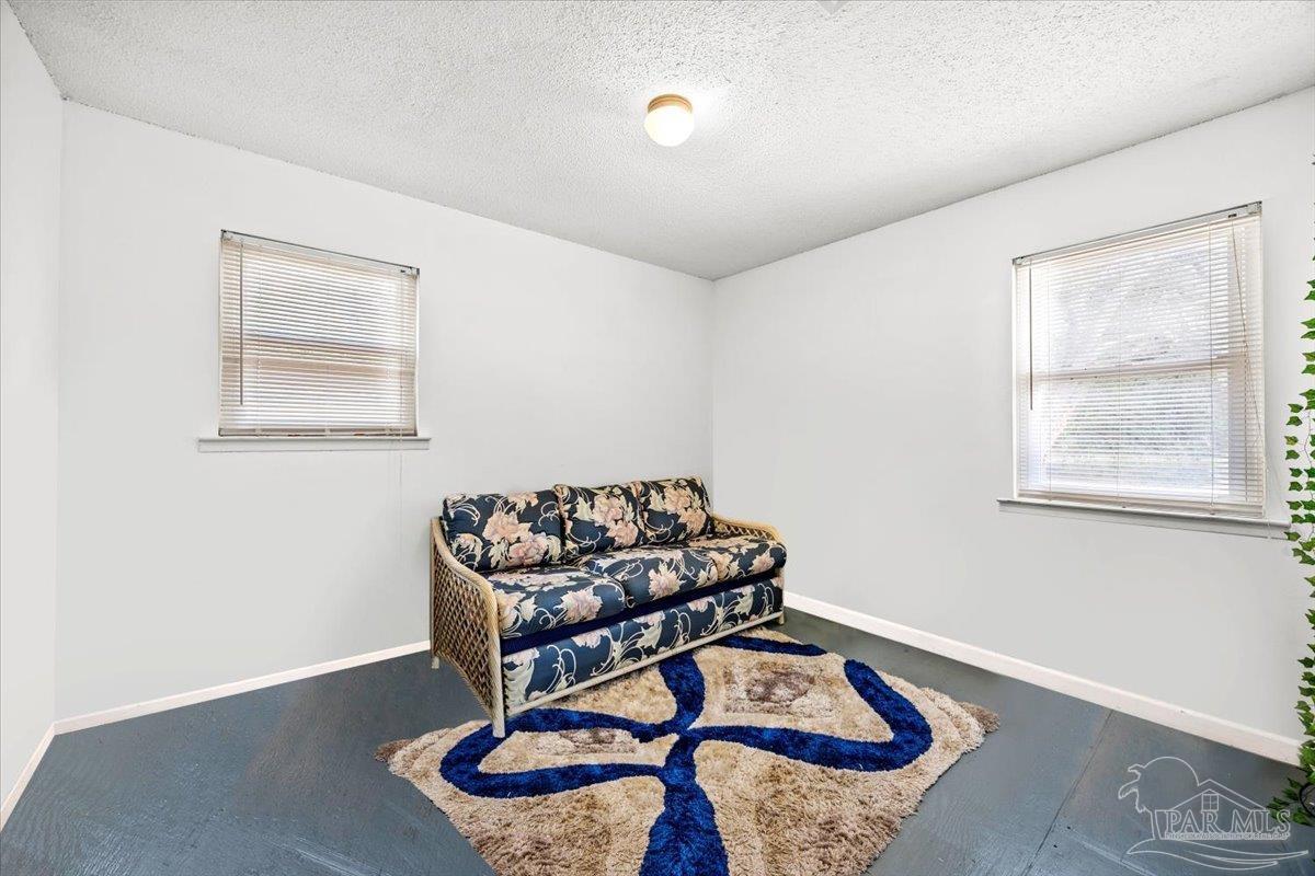 3060 Safronia Shores Road Navarre, FL 32566 - Photo 18 of 28 a living room with furniture and wooden floor