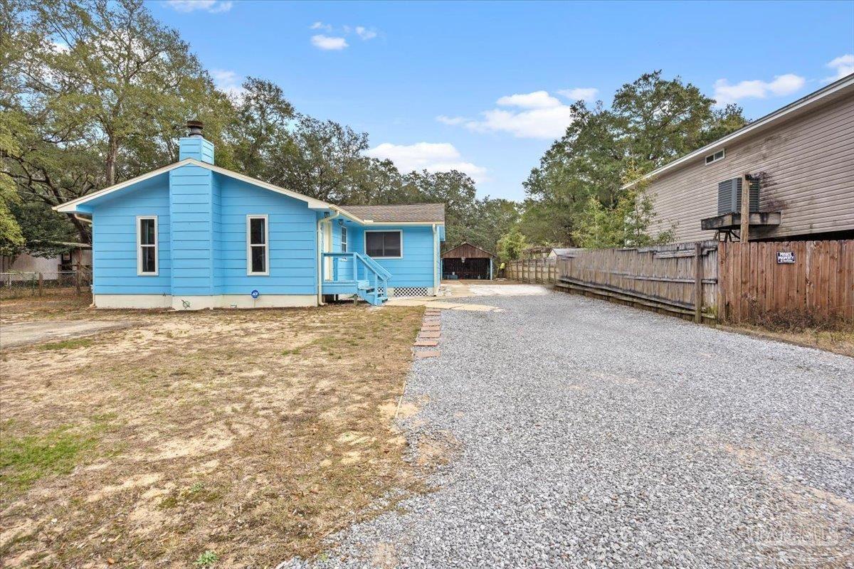 3060 Safronia Shores Road Navarre, FL 32566 - Photo 2 of 28 a house view with a outdoor space