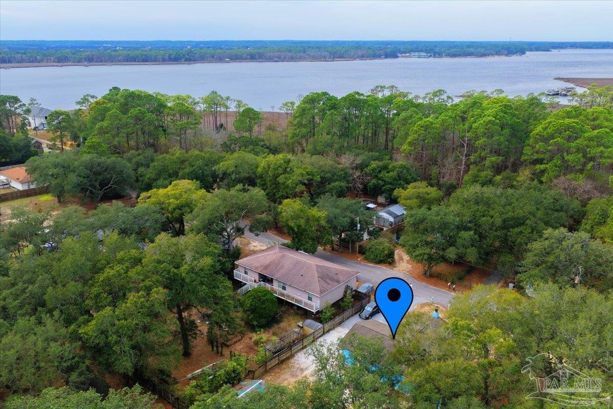 3060 Safronia Shores Road Navarre, FL 32566 - Photo 26 of 28 an aerial view of multiple house with outdoor space and lake view