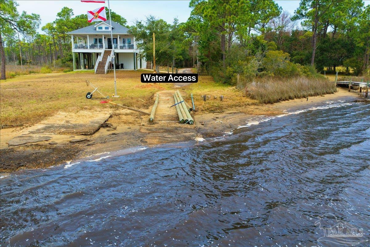 3060 Safronia Shores Road Navarre, FL 32566 - Photo 27 of 28 a view of swimming pool with an outdoor space