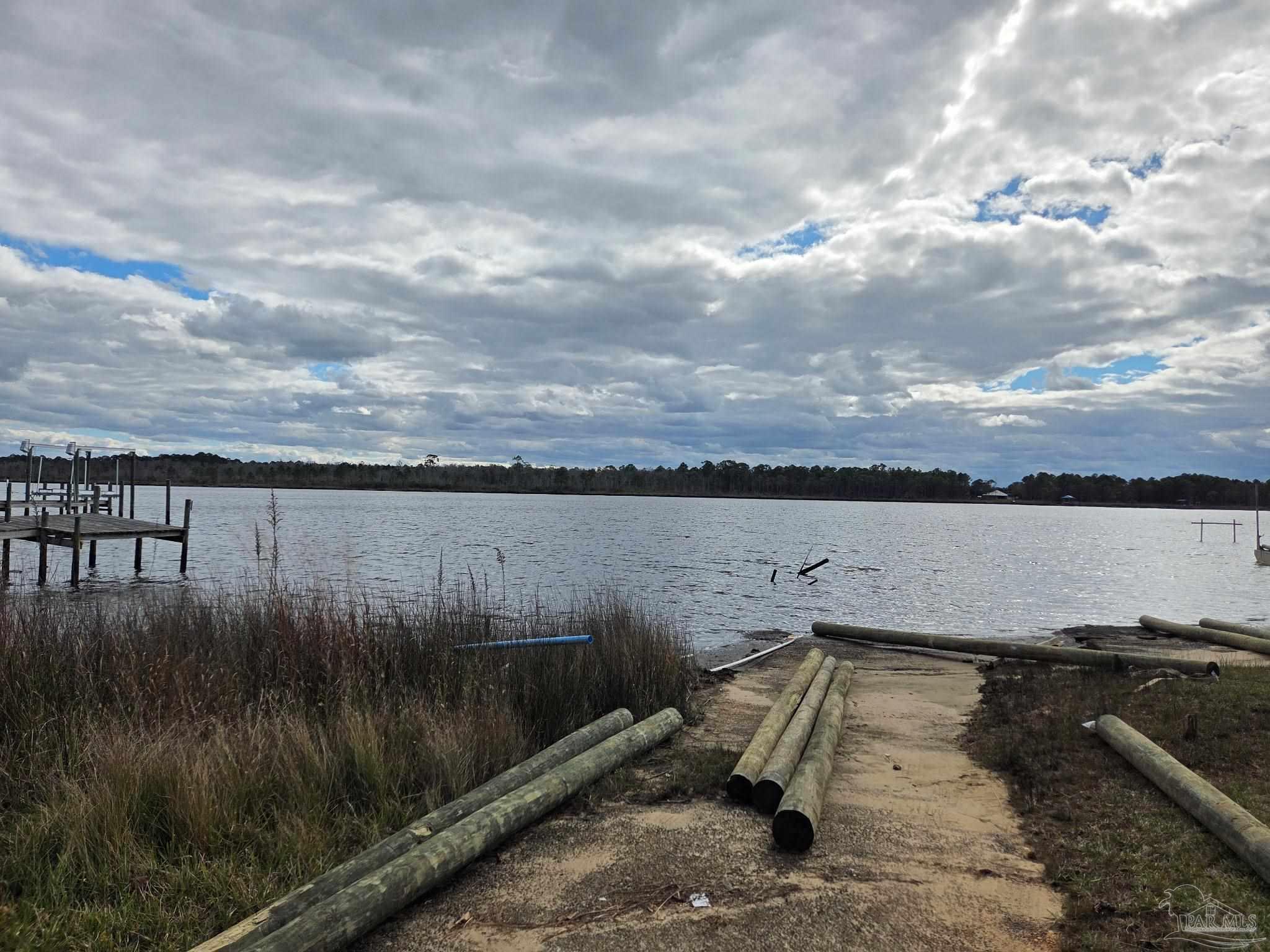 3060 Safronia Shores Road Navarre, FL 32566 - Photo 28 of 28 a view of a lake from a yard