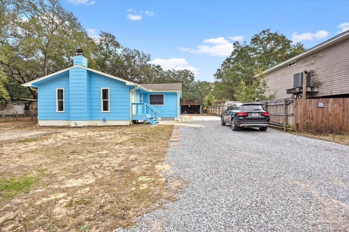3060 Safronia Shores Road Navarre, FL 32566 - Photo 3 of 28 a house view with a outdoor space
