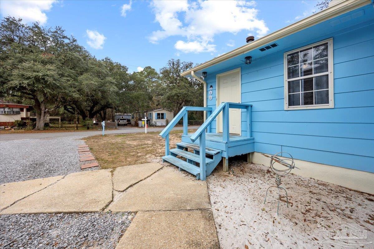 3060 Safronia Shores Road Navarre, FL 32566 - Photo 5 of 28 a house view with a backyard space