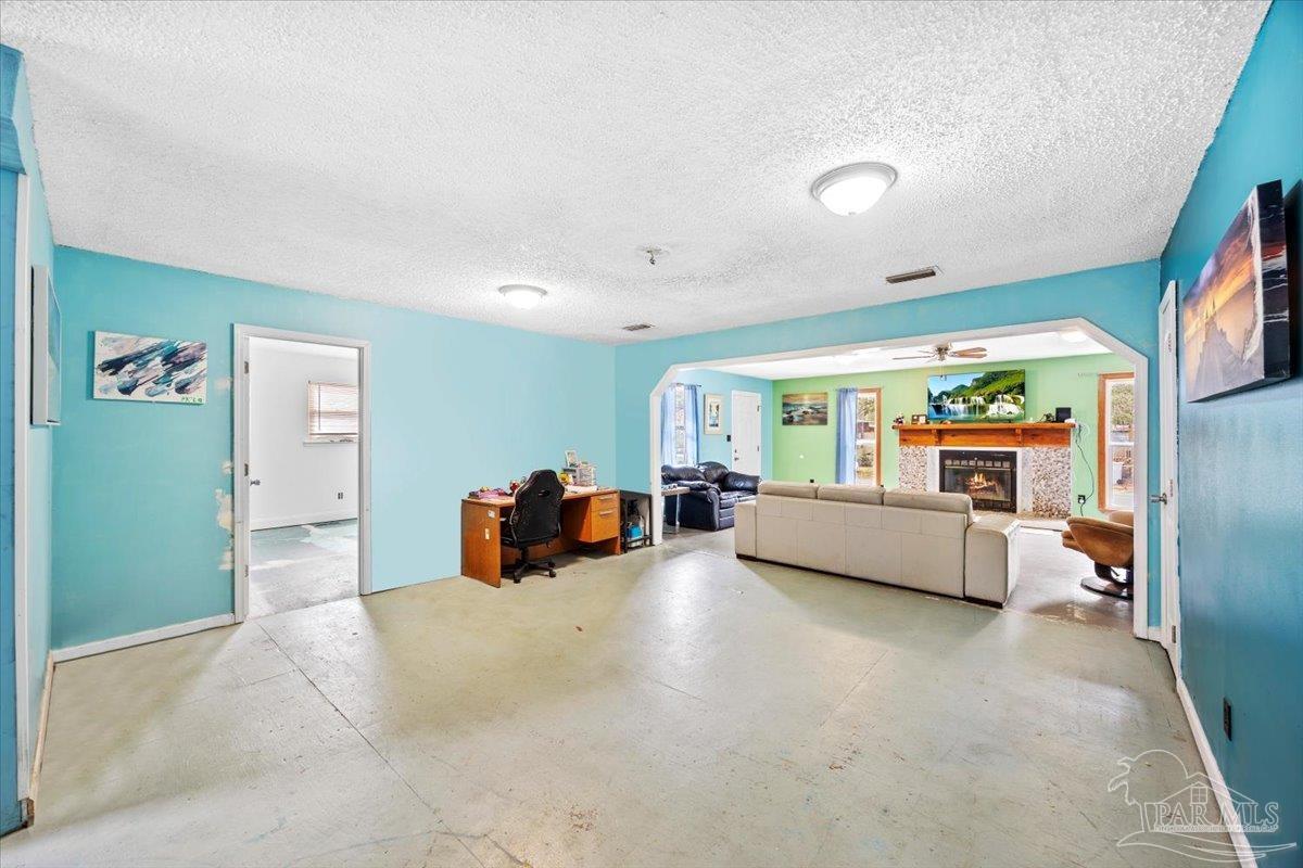 3060 Safronia Shores Road Navarre, FL 32566 - Photo 7 of 28 a bedroom with furniture and window