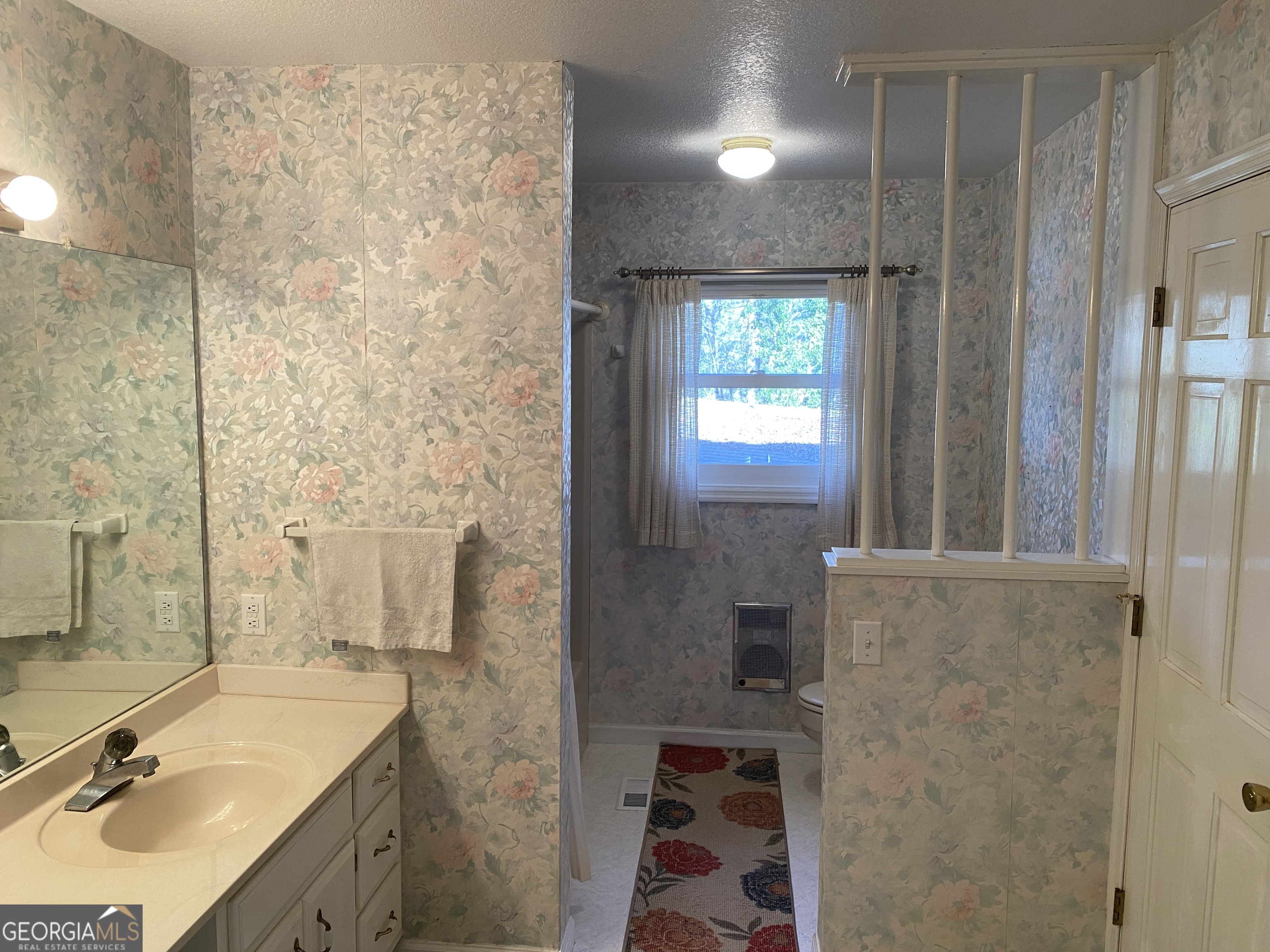 373 Western Way Rabun Gap, GA 30568 - Photo 8 of 30 a bathroom with a sink a toilet and shower
