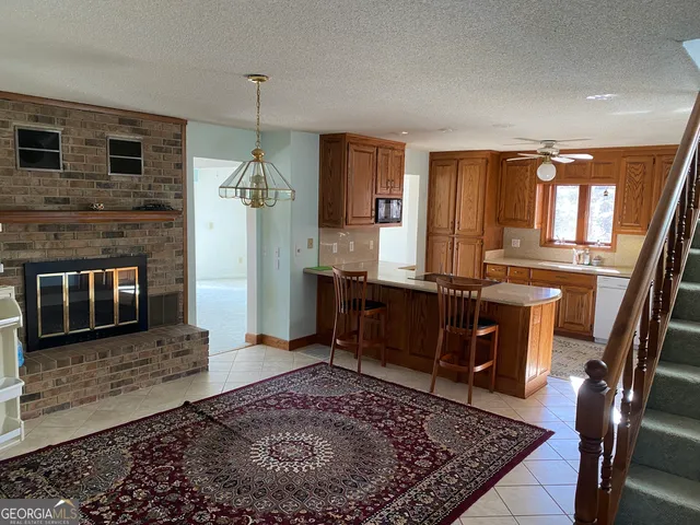 a kitchen with a refrigerator a stove sink and cabinets