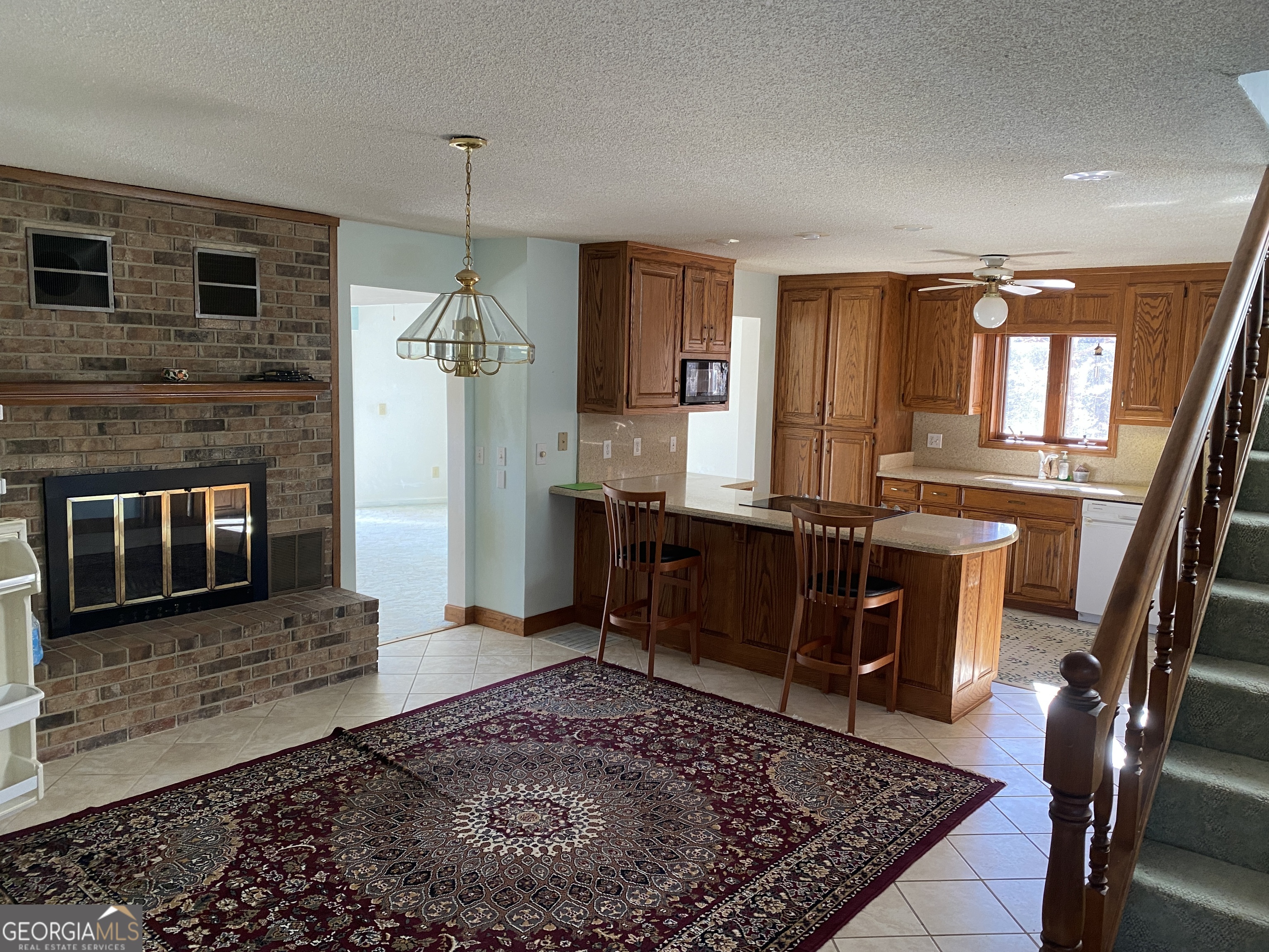 373 Western Way Rabun Gap, GA 30568 - Photo 9 of 30 a living room with furniture and a fireplace