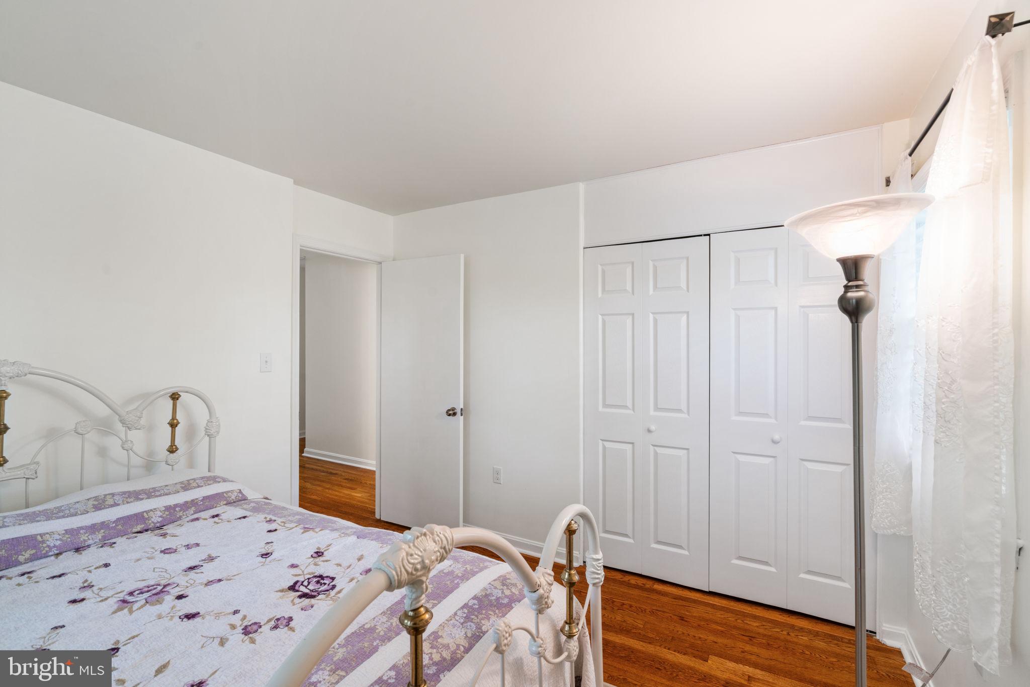 7610 Bland Drive Manassas, VA 20109 - Photo 14 of 43 a bedroom with a bed and a dresser