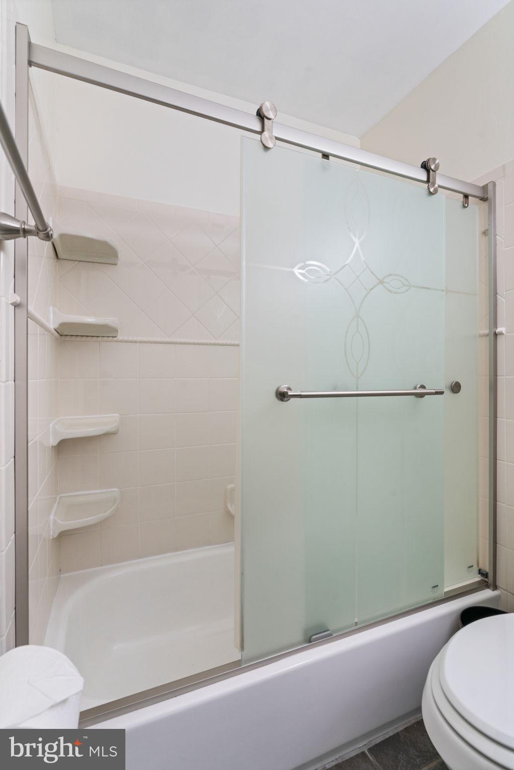7610 Bland Drive Manassas, VA 20109 - Photo 18 of 43 a bathroom with a shower and a toilet