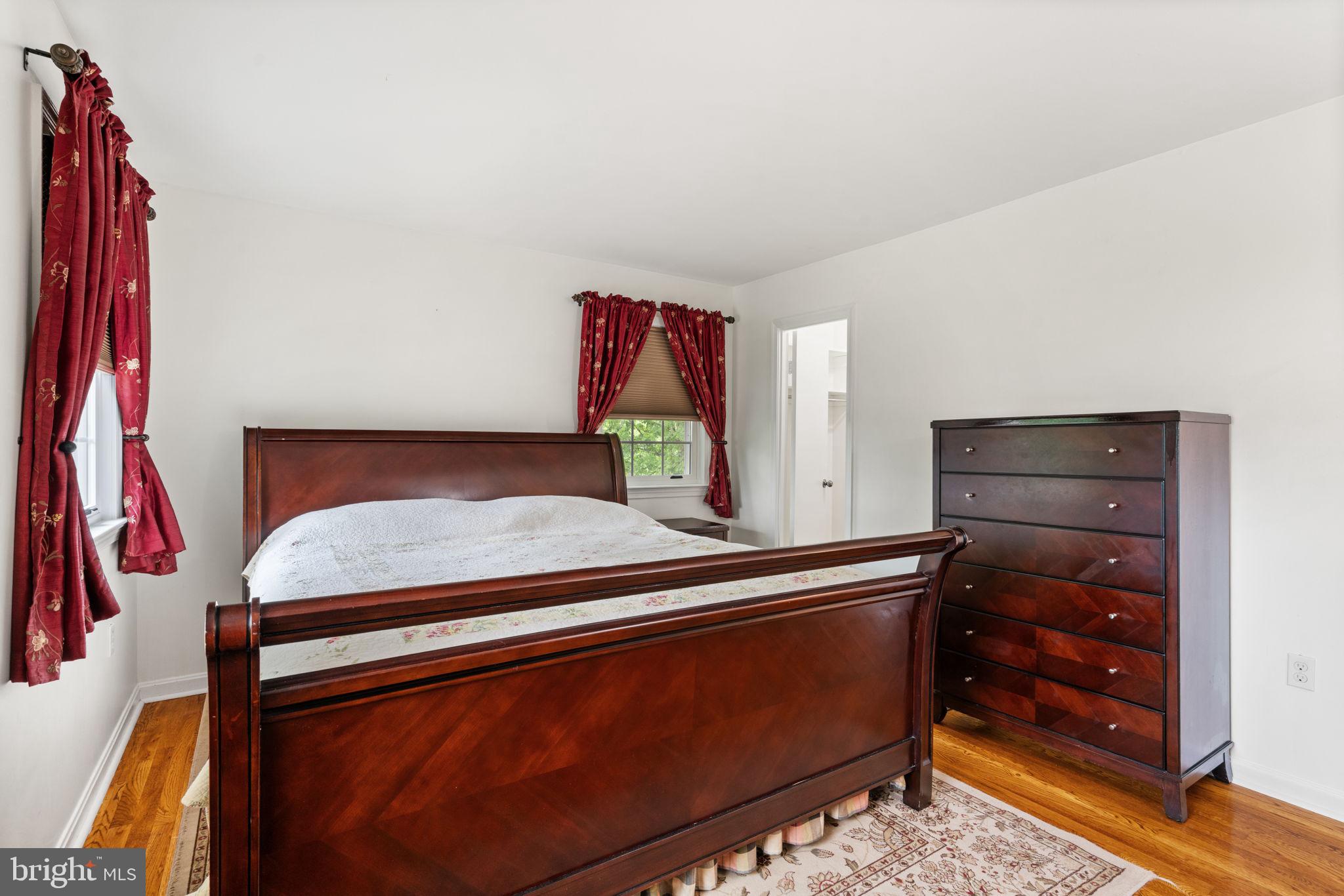 7610 Bland Drive Manassas, VA 20109 - Photo 20 of 43 a bedroom with a bed and a dresser