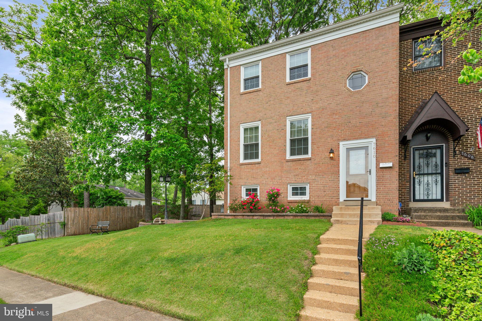 7610 Bland Drive Manassas, VA 20109 - Photo 2 of 43 a front view of a house with a yard