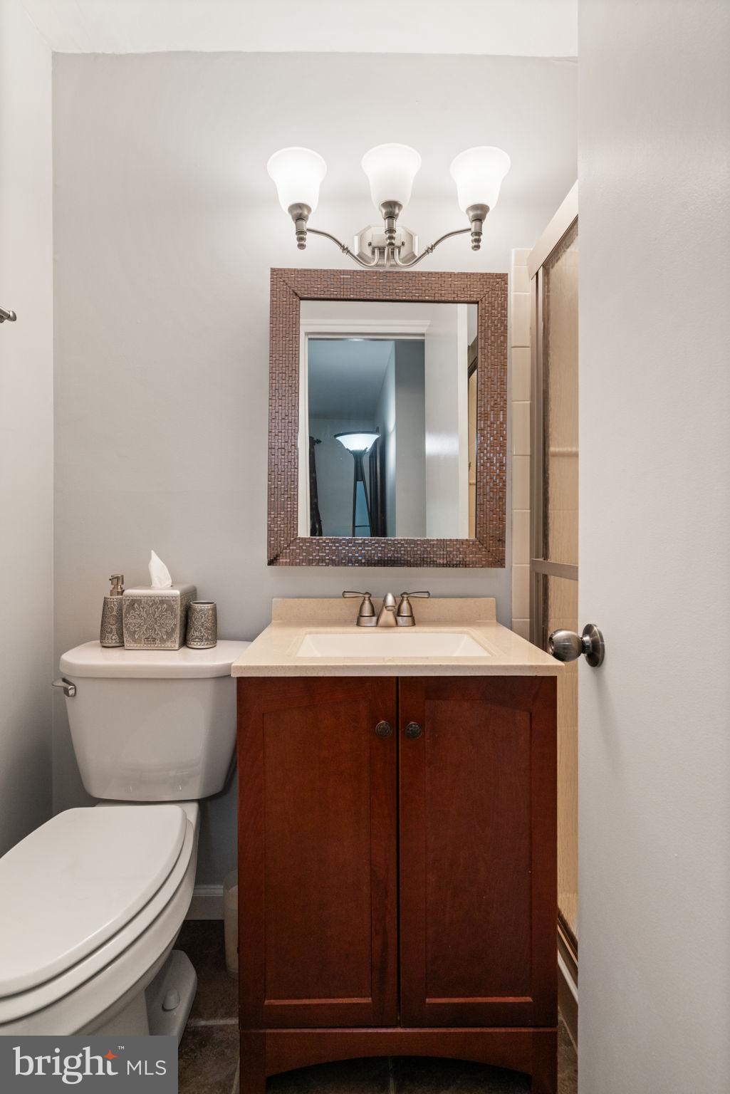 7610 Bland Drive Manassas, VA 20109 - Photo 24 of 43 a bathroom with a toilet sink and mirror